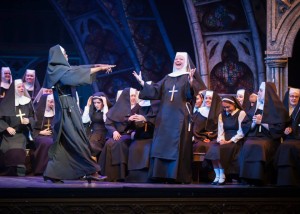Sinead Coll as Sister Mary Patrick in "Sister Act" with Jean Michelo as Dolores Van Cartier and the Belfast Operatic Company chorus.